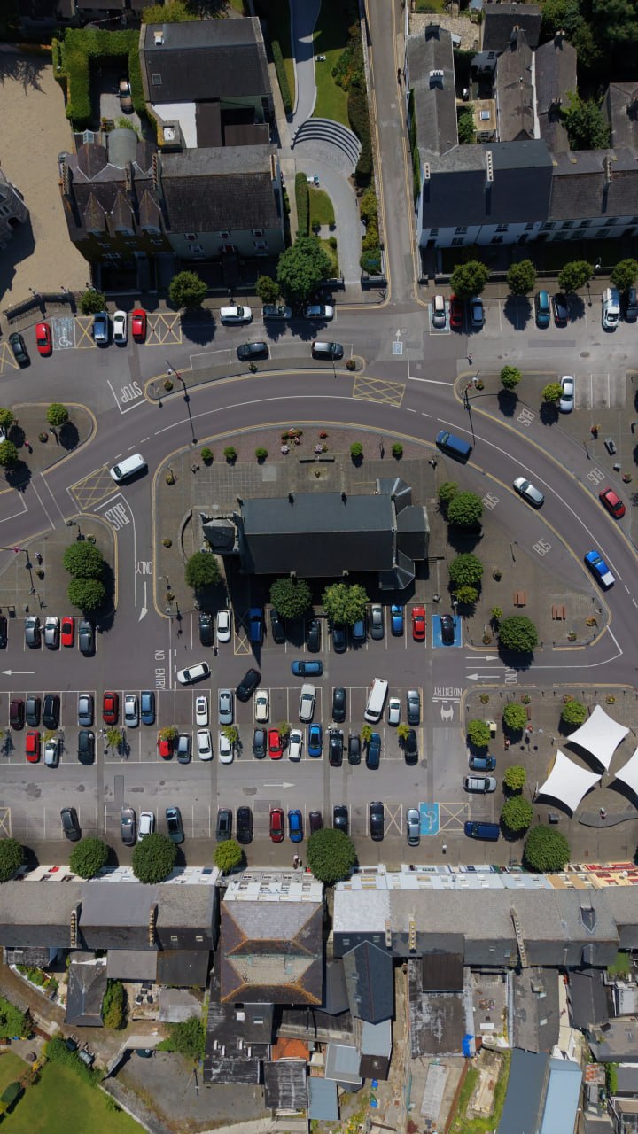 Aerial view of Listowel Square with the central market house, parked cars and surrounding streets