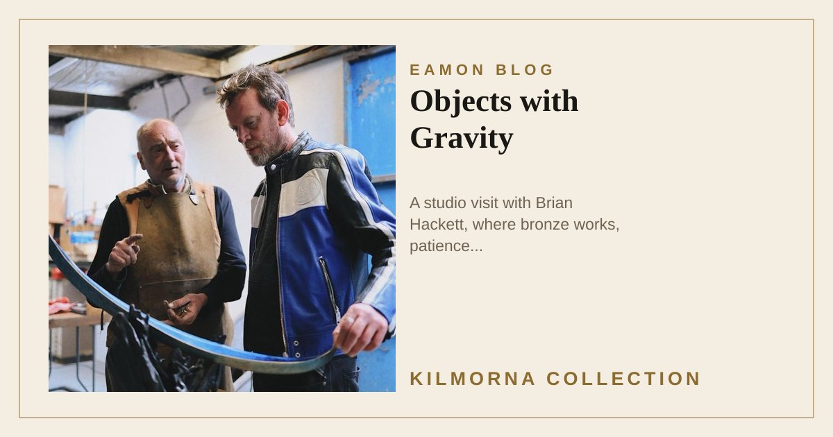 Brian Hackett and Eamon Lane looking at a bronze sculpture in Brian Hackett studio
