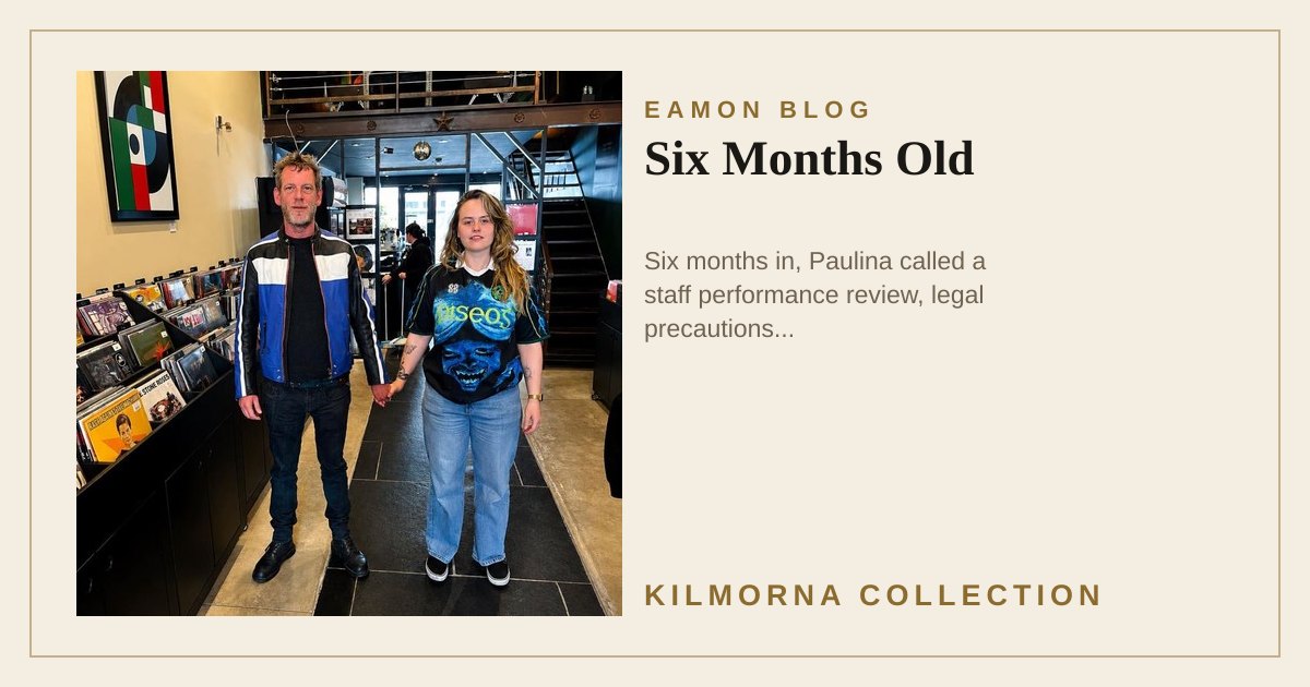 Eamon Lane and Niamh standing in The Kilmorna Collection holding hands at a careful distance