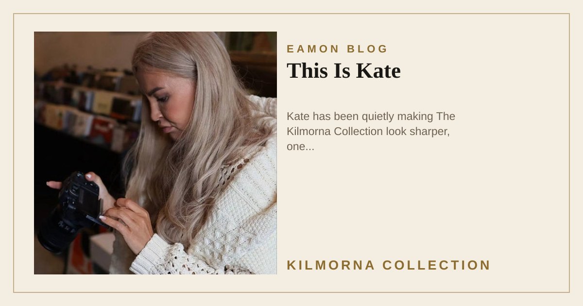 Kate checking a camera inside The Kilmorna Collection, with records and artwork behind her