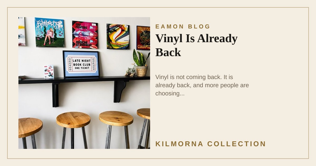 Vinyl records displayed on a wall shelf above stools inside The Kilmorna Collection